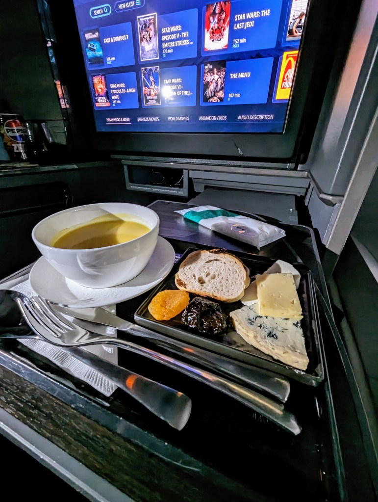 Corn soup and cheese plate served on ANA business class