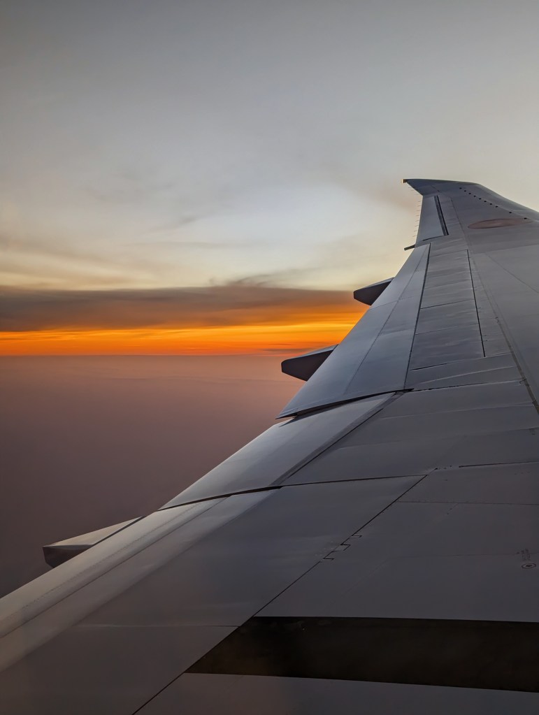 View of sunset from window seat in ANA