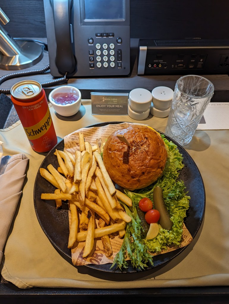 Burger with fries and soda at Sama Sama Hotel in KLIA