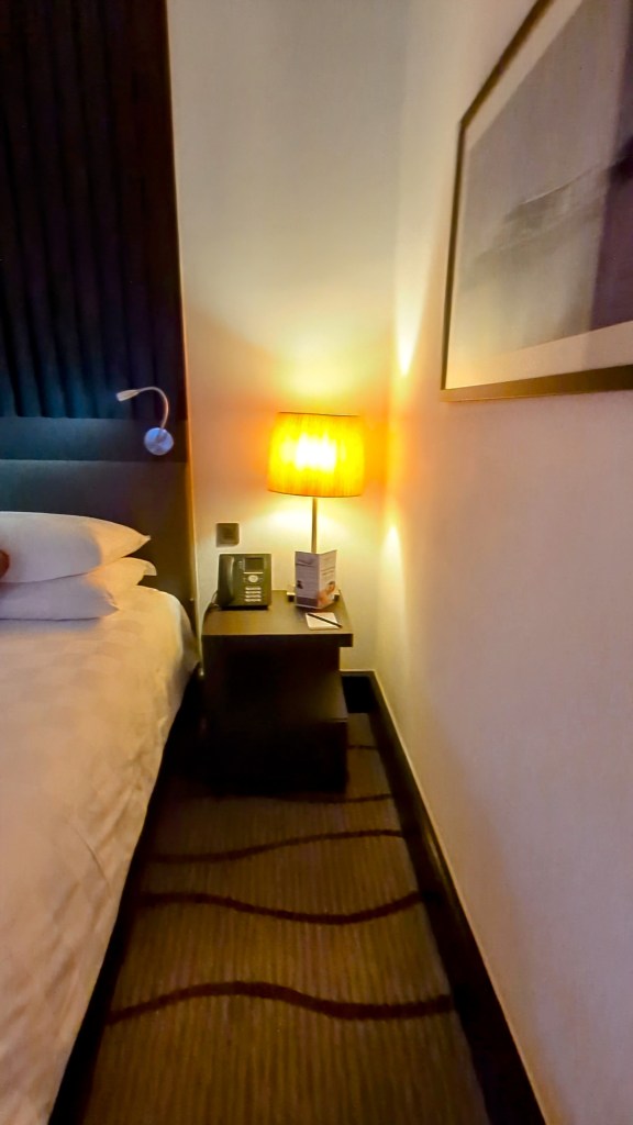 Side table next to bed at Sama Sama Hotel in KL