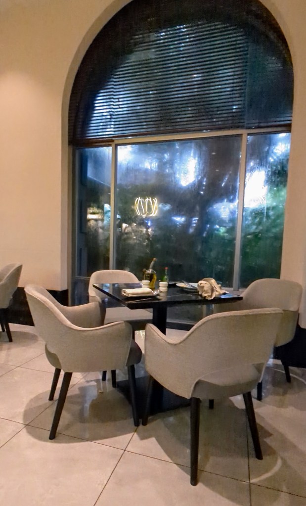 Seating area inside restaurant of Sama Sama Hotel in Kuala Lumpur