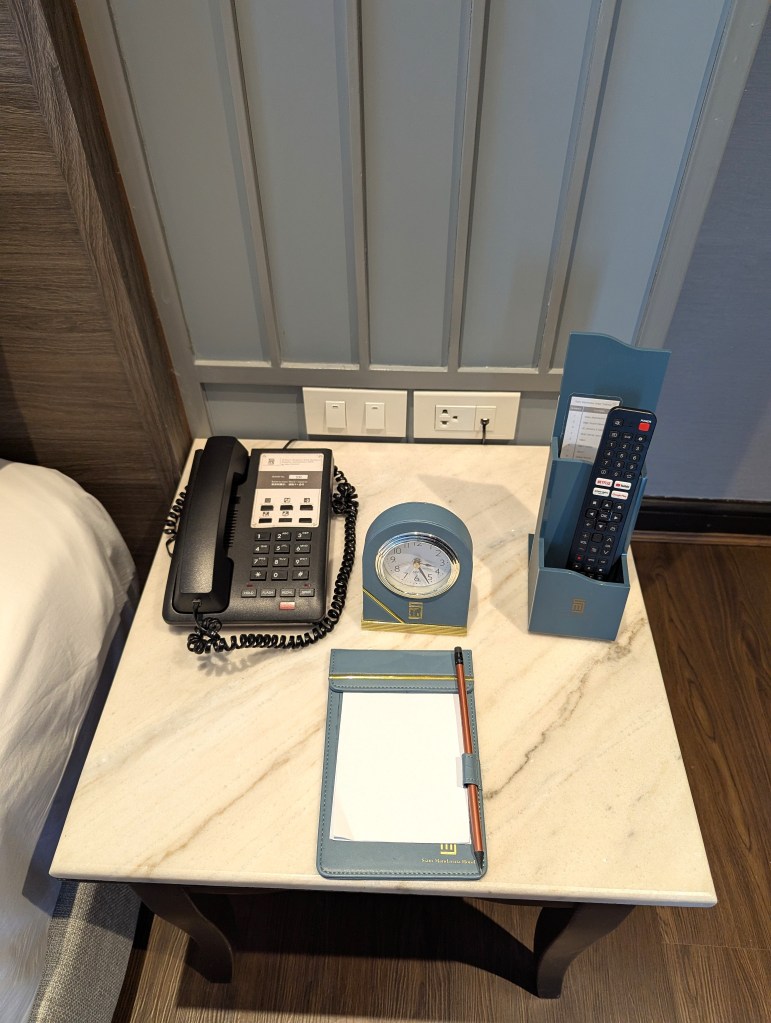 Bedside table in Executive Suite of Siam Mandarina Hotel in Bangkok.