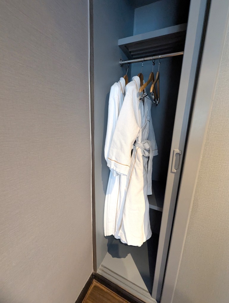 Robes in closet at Siam Mandarina Hotel in Bangkok.