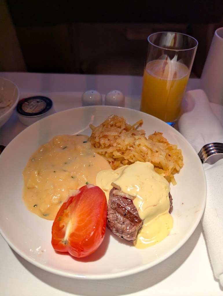 Scrambled eggs with chives brunch served in business class of Emirates Airlines