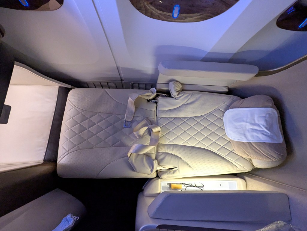 Full lie flat seat in business class section of Emirates Airlines