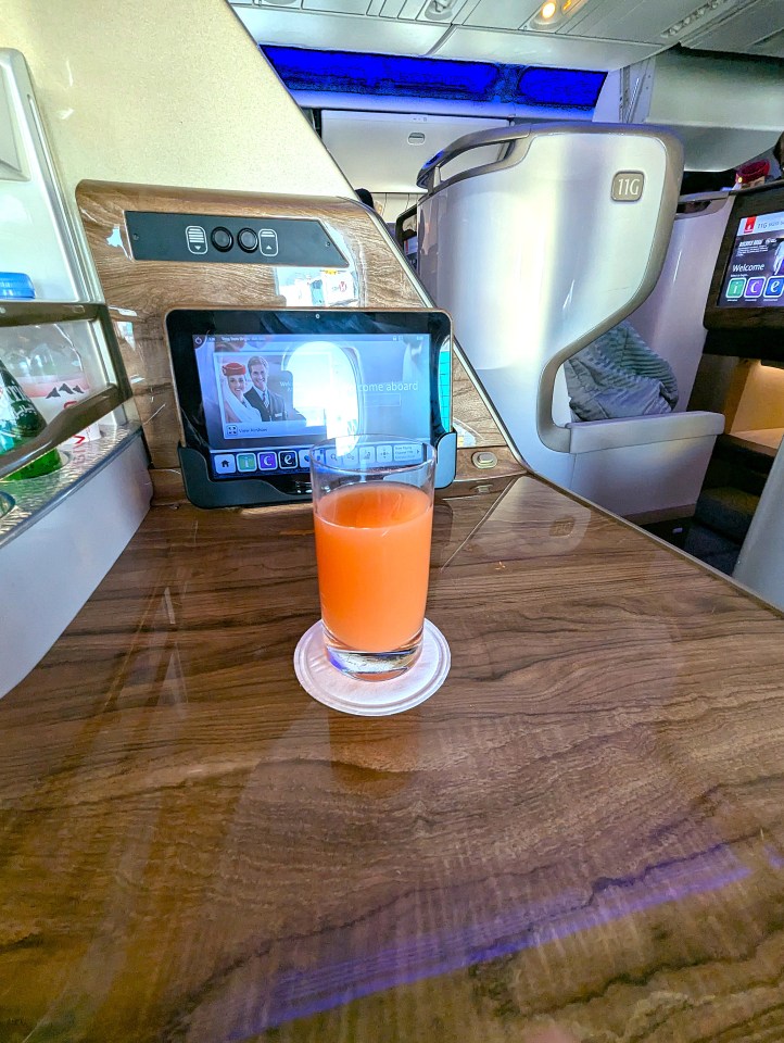 Grapefruit juice welcome drink in business class of Emirates Airlines