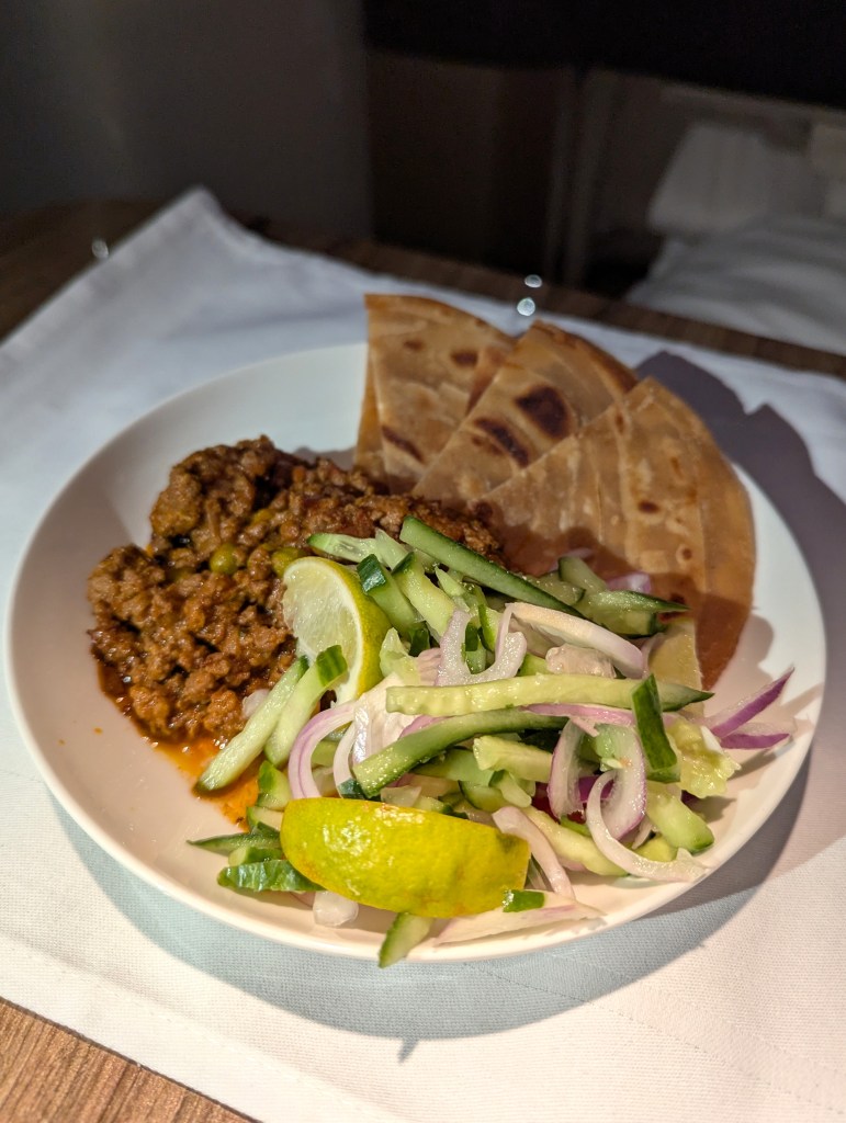 Kheema Mutter offered in light bites section menu of Emirates Airlines business class