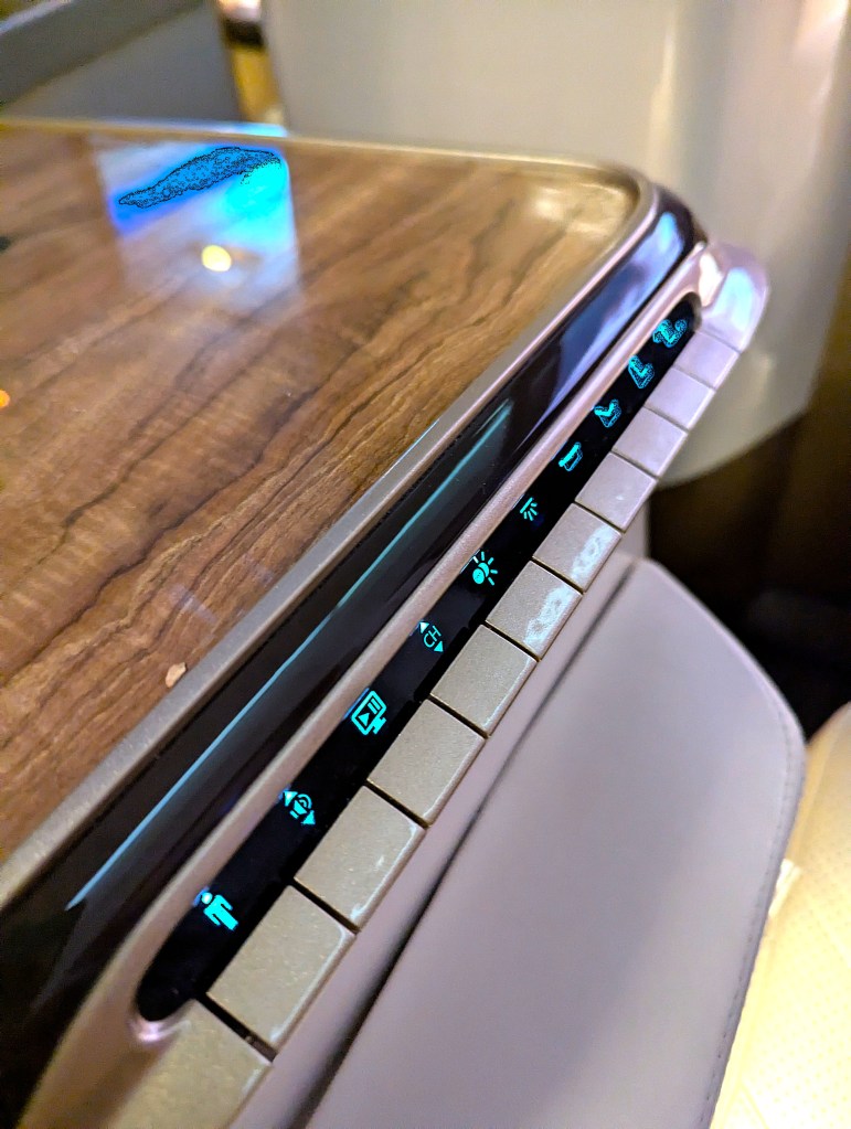 Physical control buttons in business class seat of Emirates Airlines