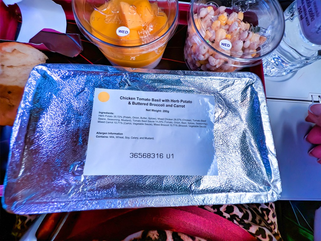 Chicken tomato basil meal served on Qatar Airways economy class