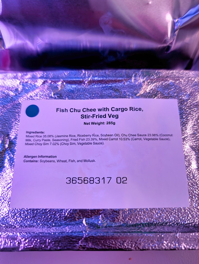 Fish Chu Chee meal served on Qatar Airways economy class