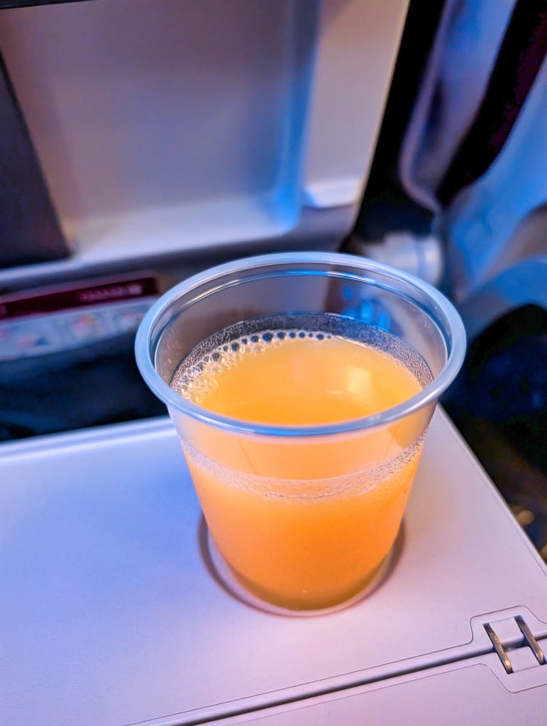 Orange juice provided on Qatar Airways economy class