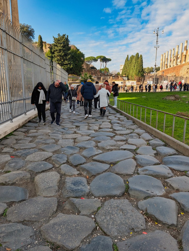 Cobbled path new the Colosseum in Rome Italy