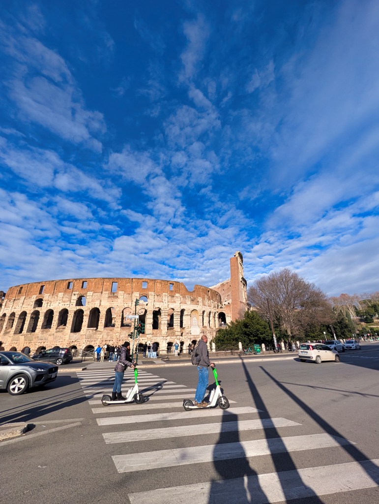 View of the Colosseum across the street in Rome Italy