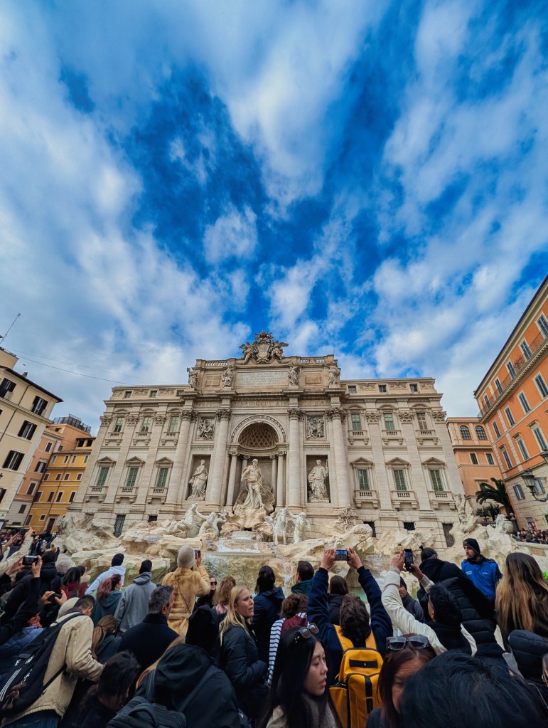 Trevi Fountain in Rome with large crowd