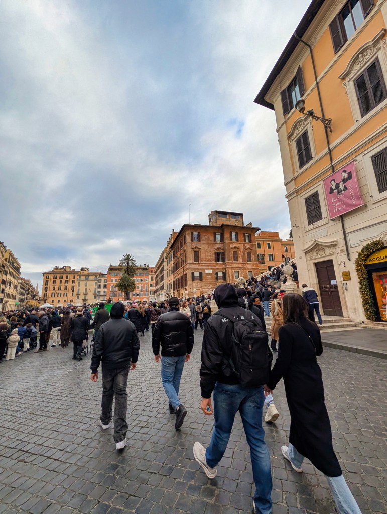 People walking toward Spanish Steps in Rome, Italy.
