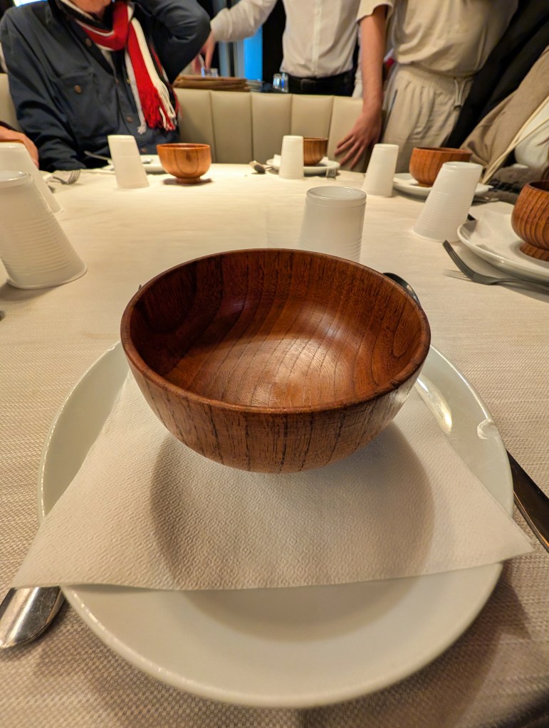 Table with plate and bowl in Tien Tsin Chinese Restaurant in Rome, Italy.