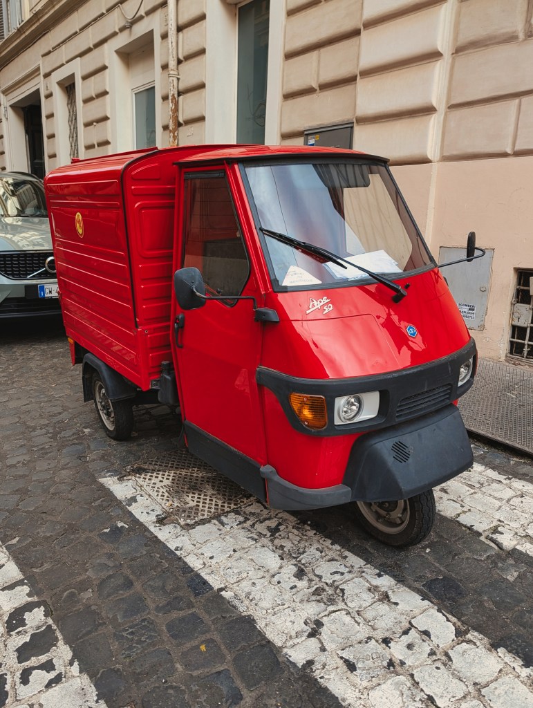 Three wheeler delivery van in Rome, Italy.