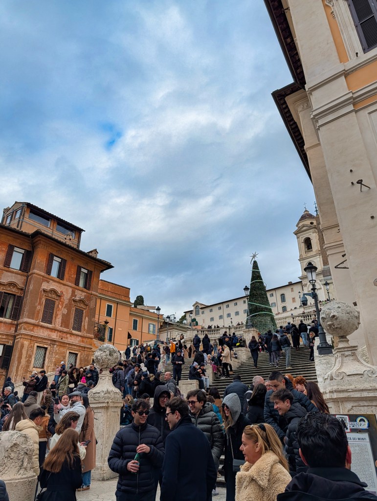 View of Spanish Steps in Rome with tourists.